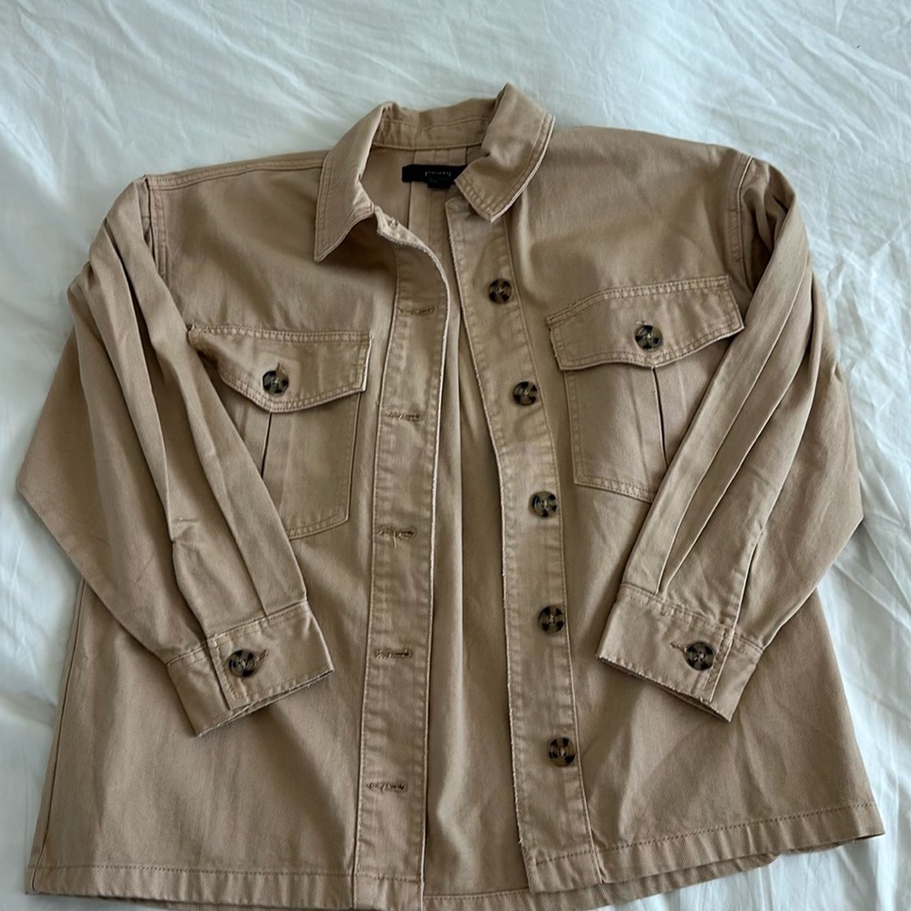 Tan button down oversize denim jacket, lightweight material with breast pockets